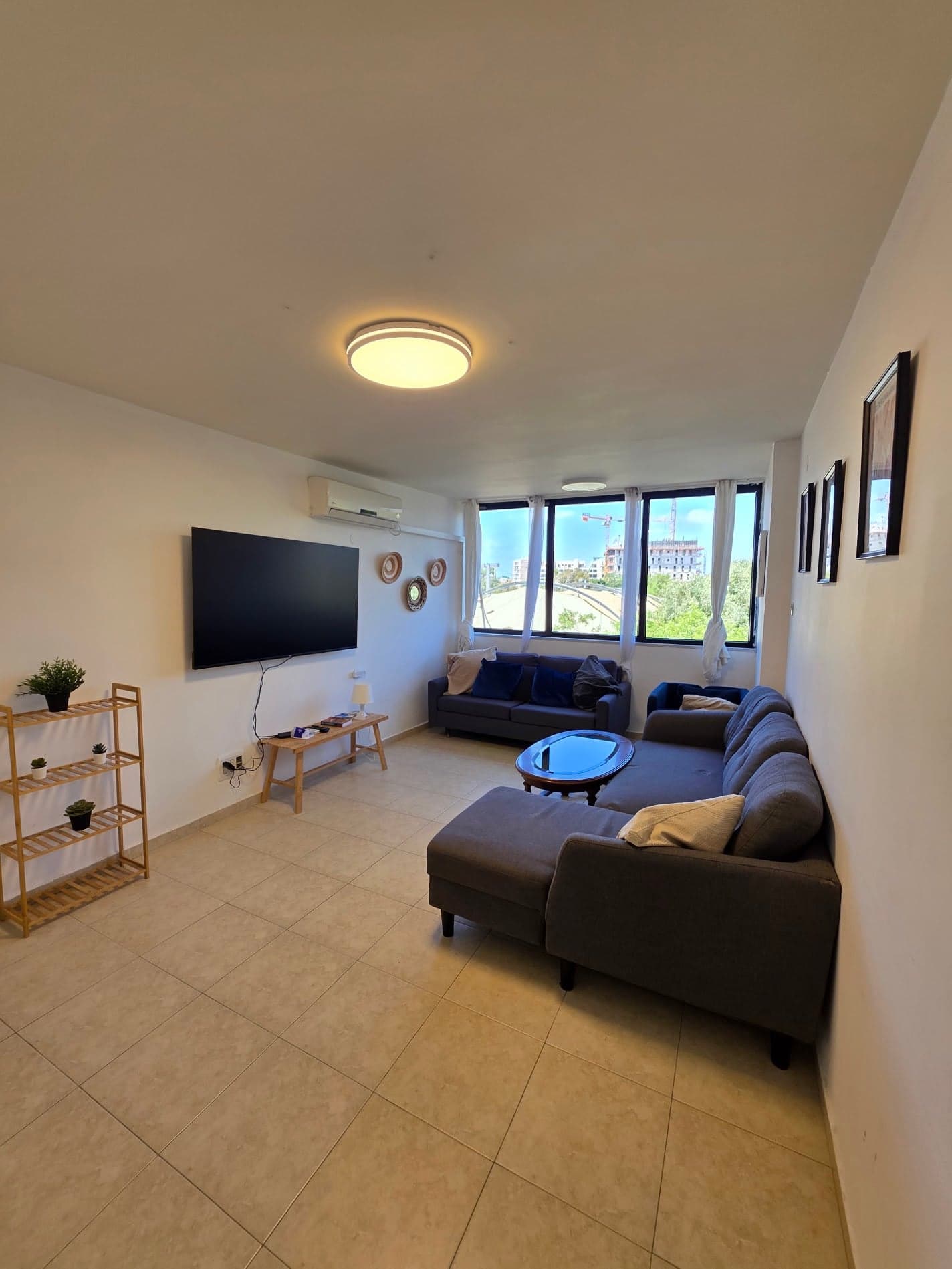 Bright living room with panoramic Jaffa view