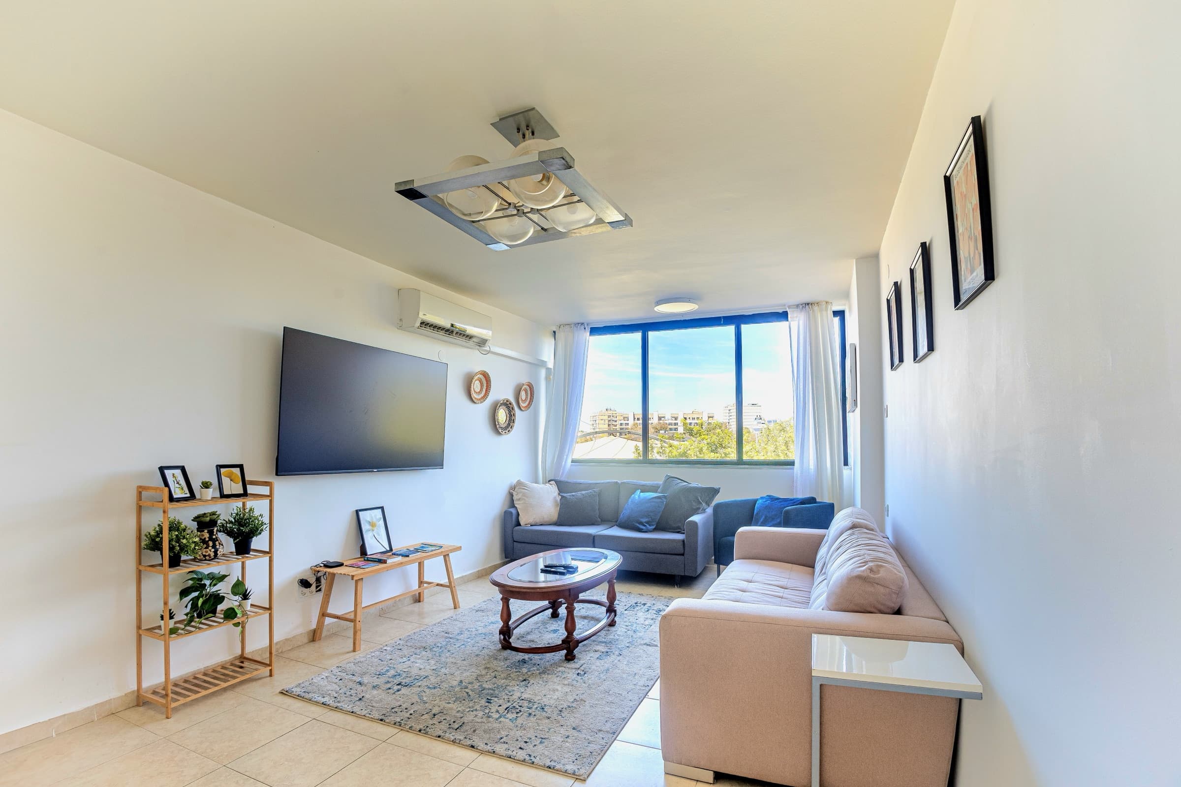 Bright living room with panoramic Jaffa view